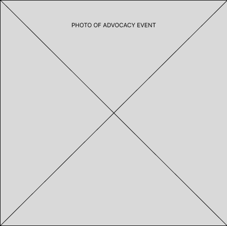 Photograph of students hanging pride posters